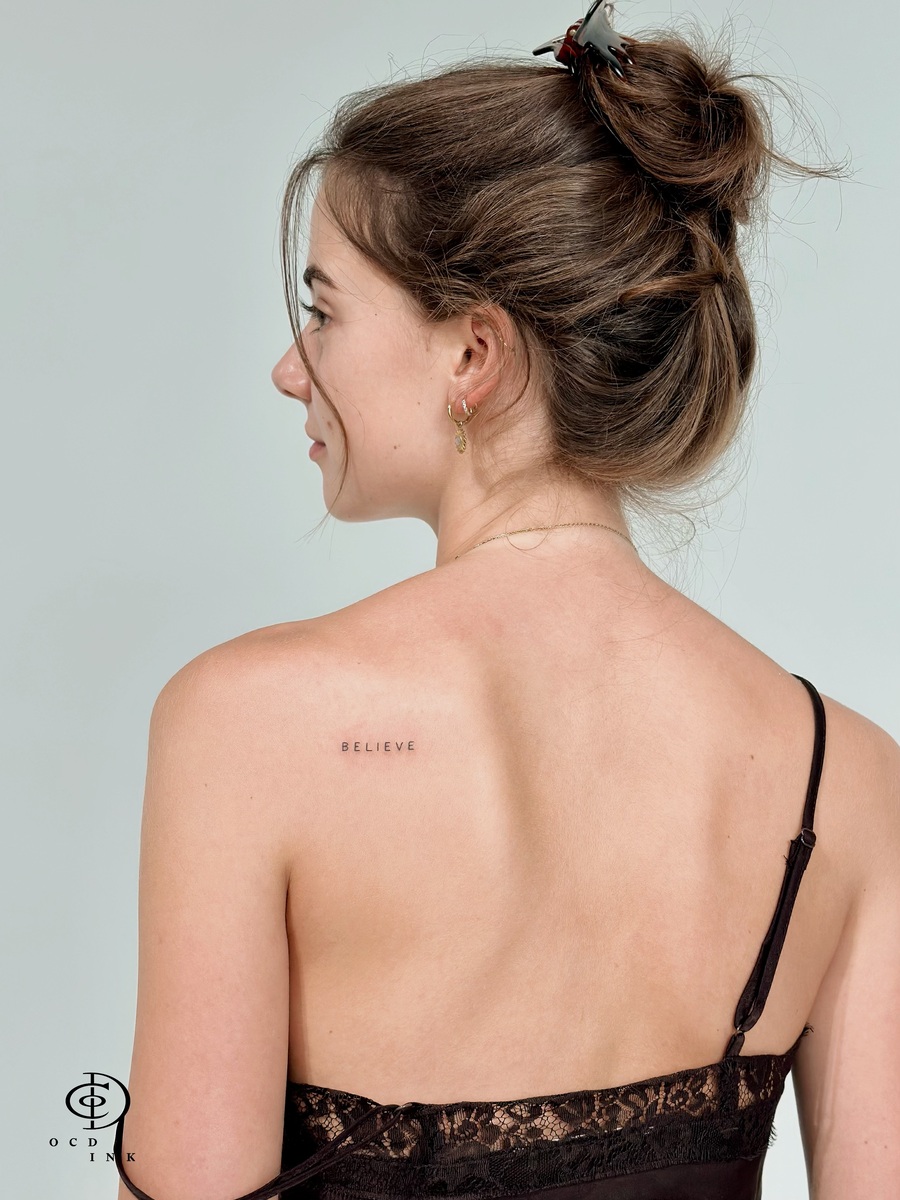 beautiful customer with fineline tattoo on the back - our client - OCD Ink Studio