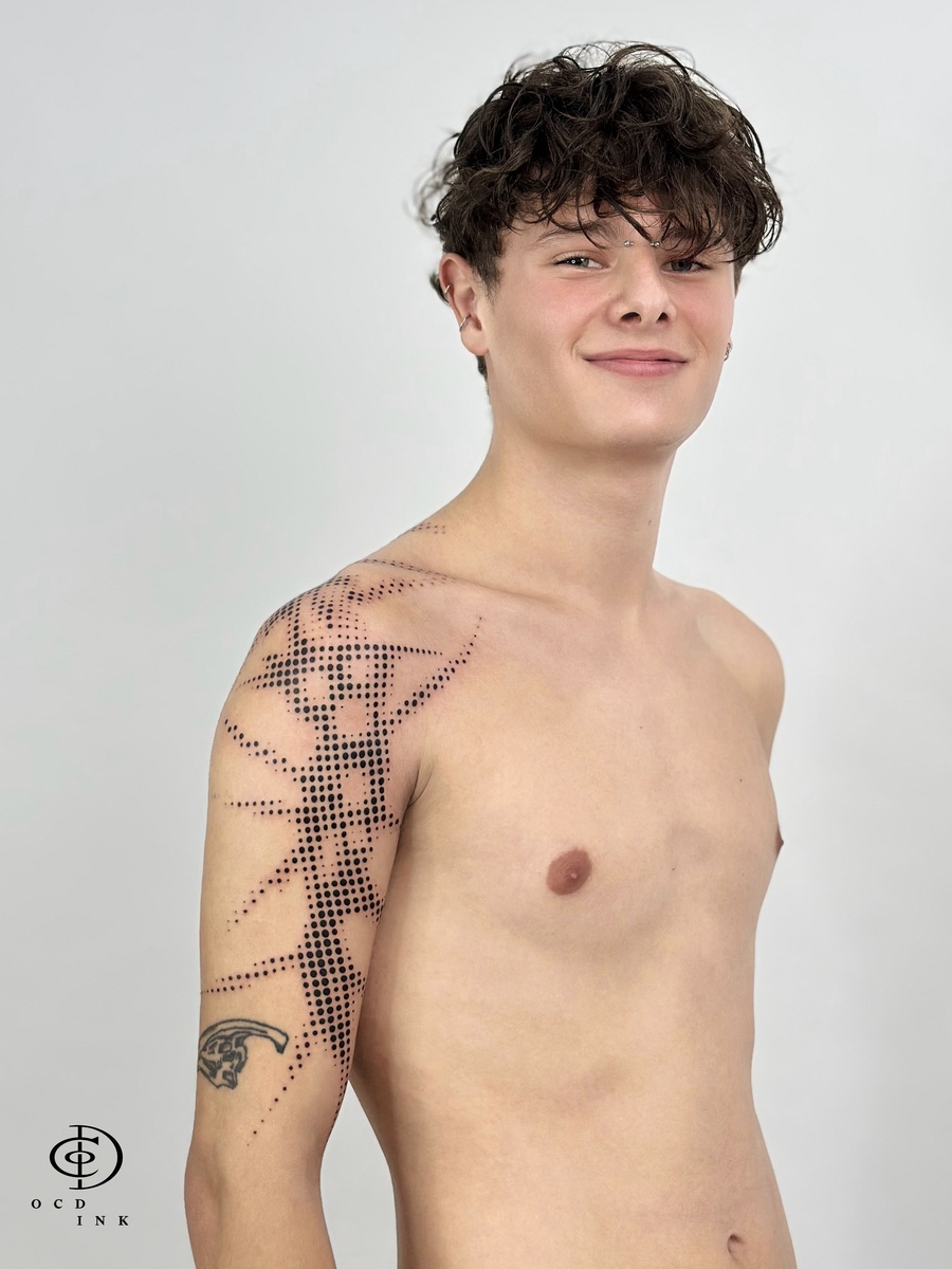 young boy with half tone tattoo on shoulder - our client - OCD Ink Studio
