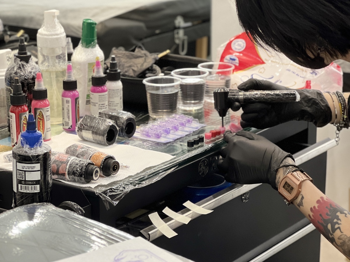 Professional medical-grade workstation at OCD Ink Studio with premium inks and sterile equipment.