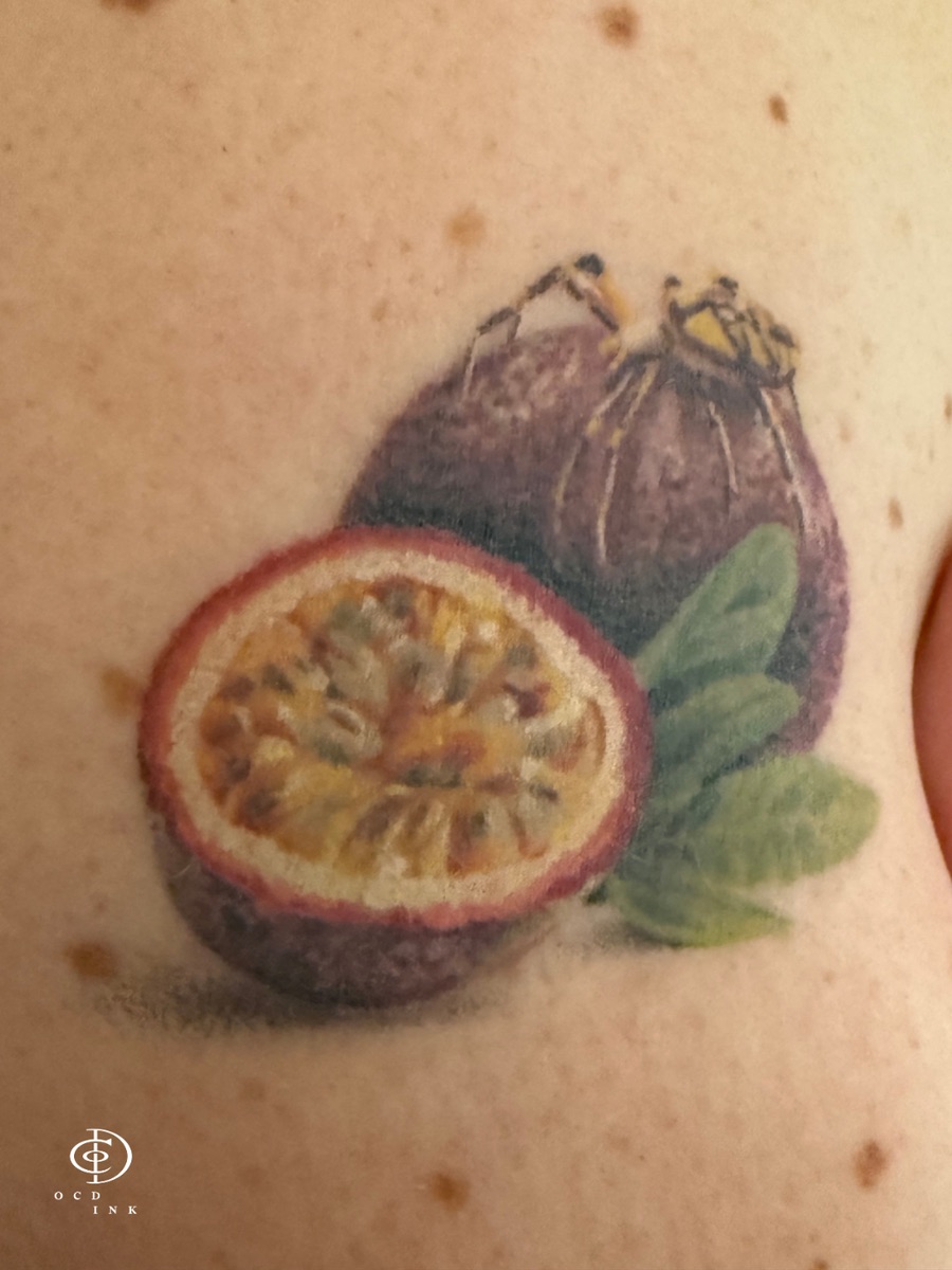 A healed color realistic passionfruit tattoo by OCD Ink Studio Hanoi