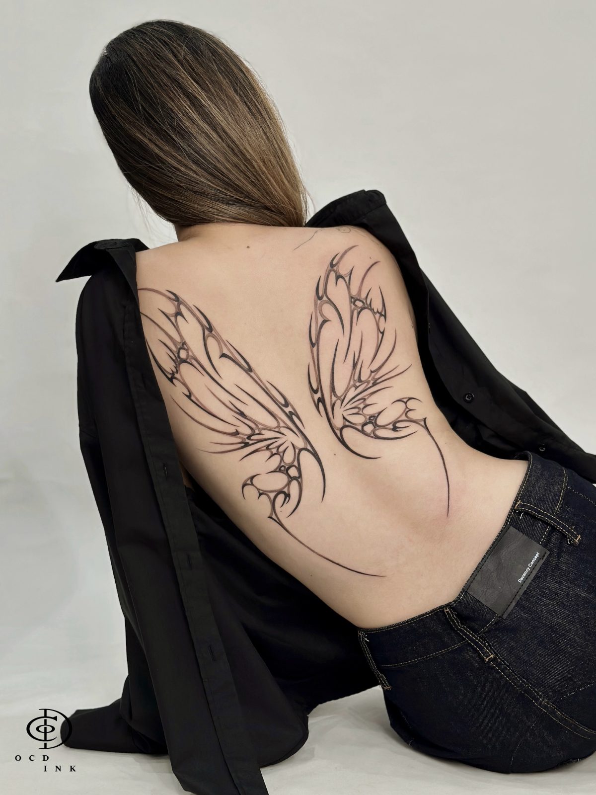 Blackwork cybersigilism style wing tattoo - OCD Ink Studio