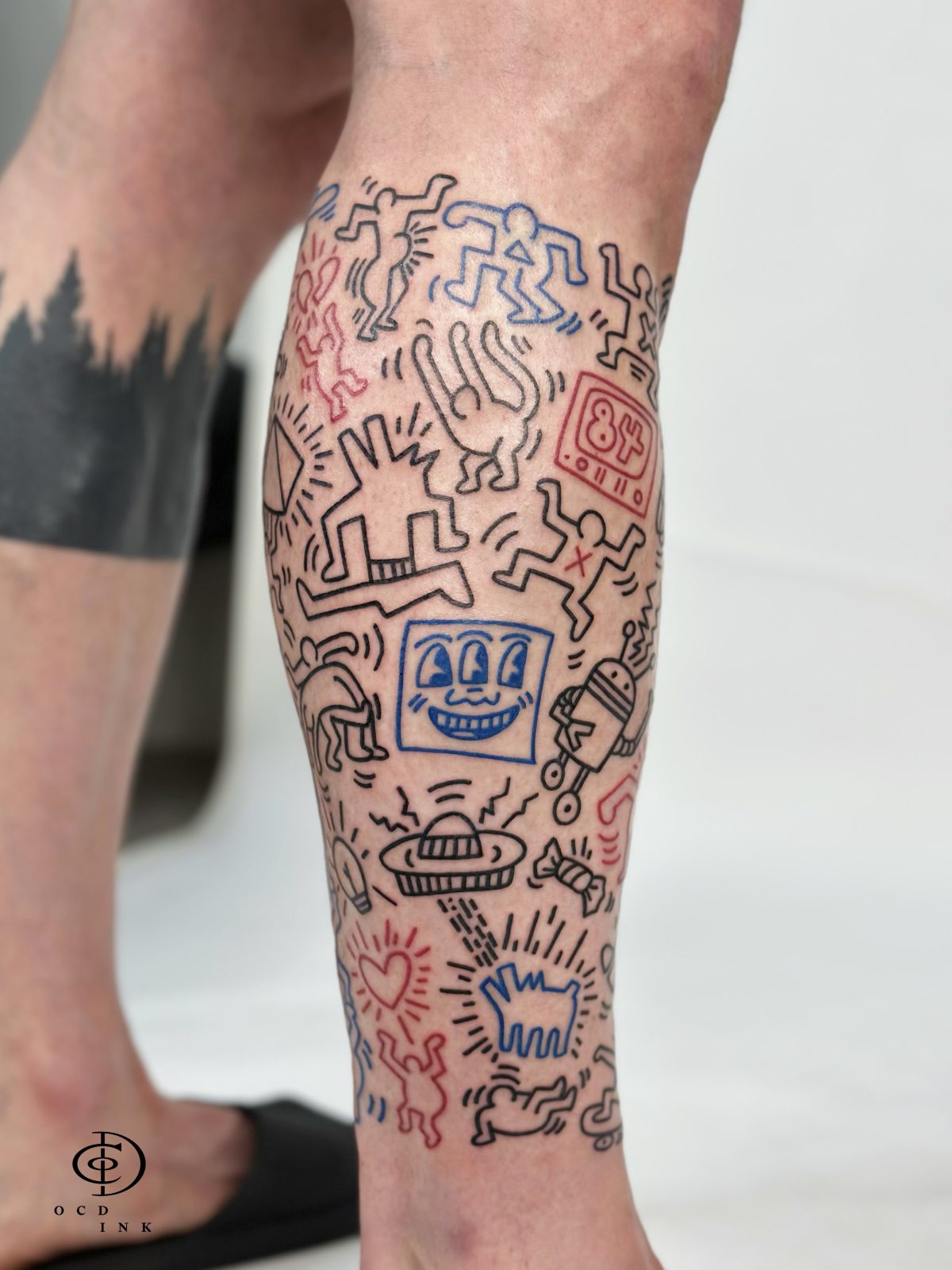 Keith Haring doodle style tattoo - OCD Ink Studio 2