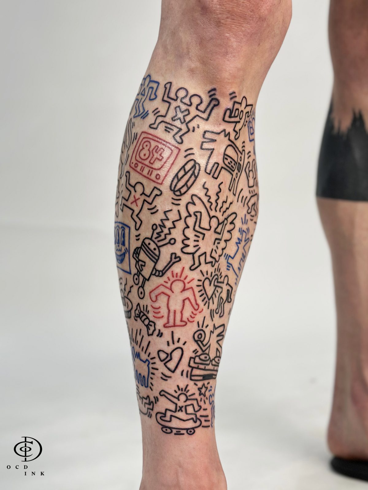 Keith Haring doodle style tattoo - OCD Ink Studio