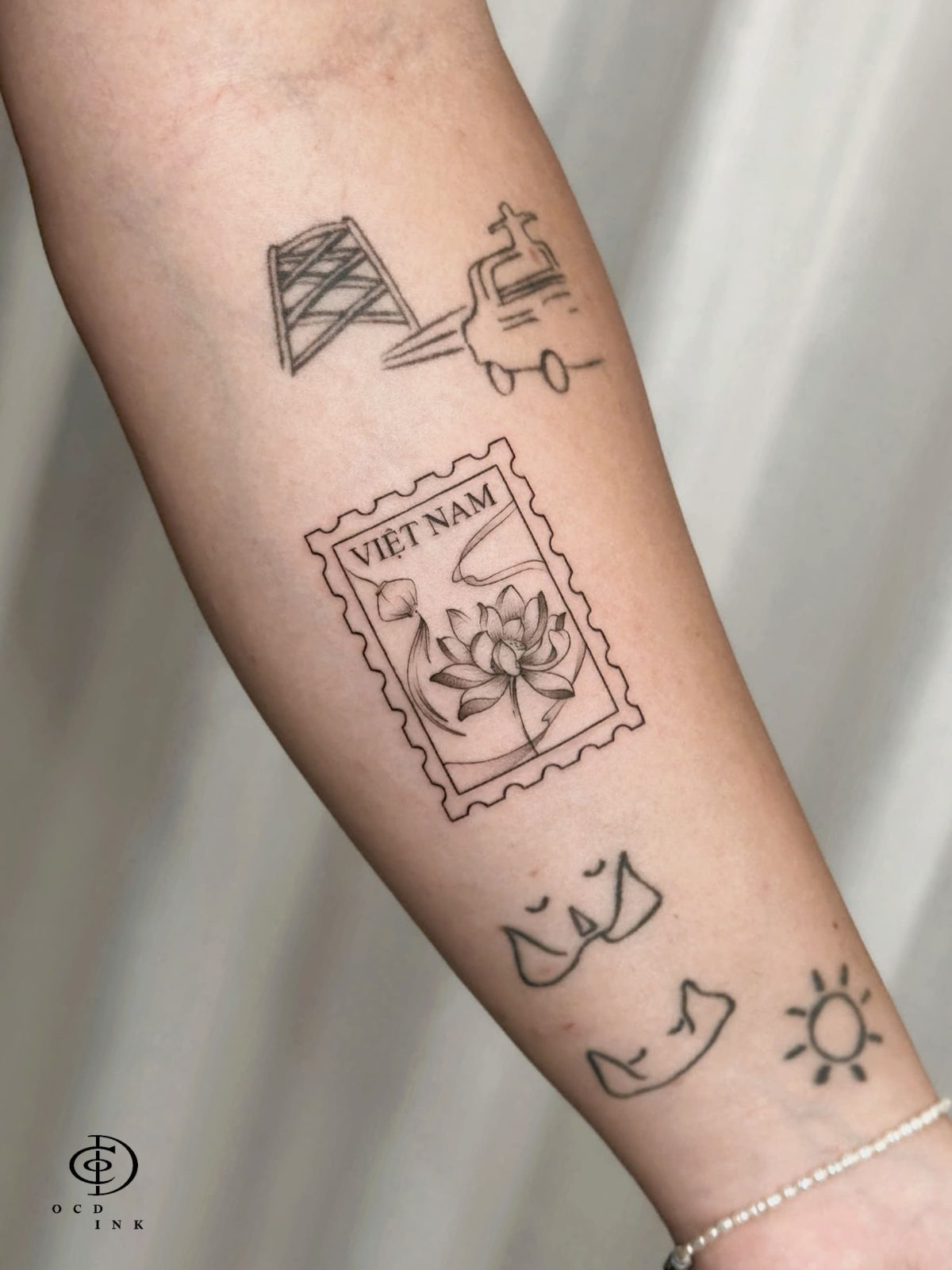 vietnam lotus stamp tattoo - OCD Ink Studio