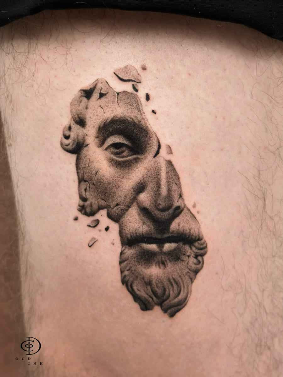 Blackwork Dotwork blackwork tattoo of a fragmented classical Greek statue face with realistic shading and stippling