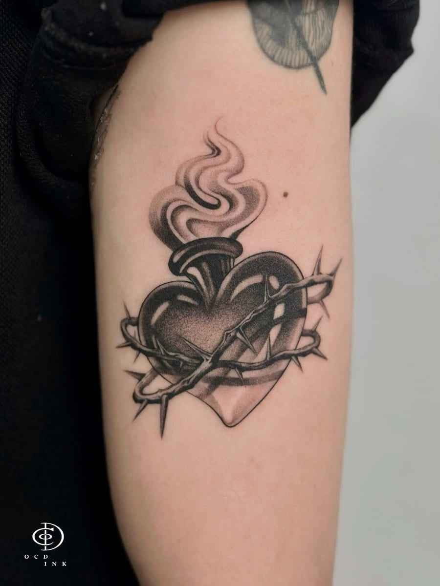 Blackwork Dotwork blackwork tattoo of a sacred heart wrapped in thorns with smoke and stippled shading