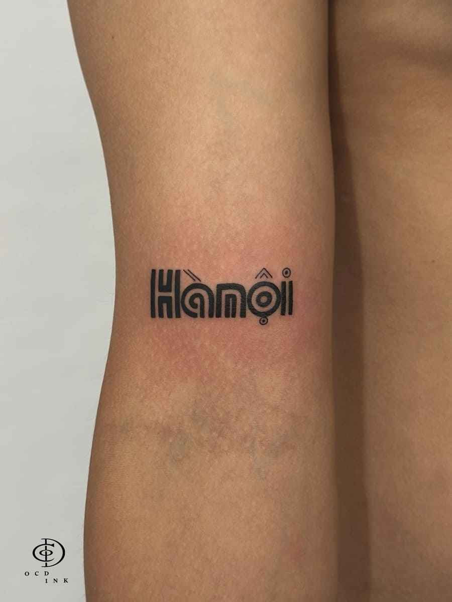 Custom Hanoi typography tattoo in modern Vietnamese lettering