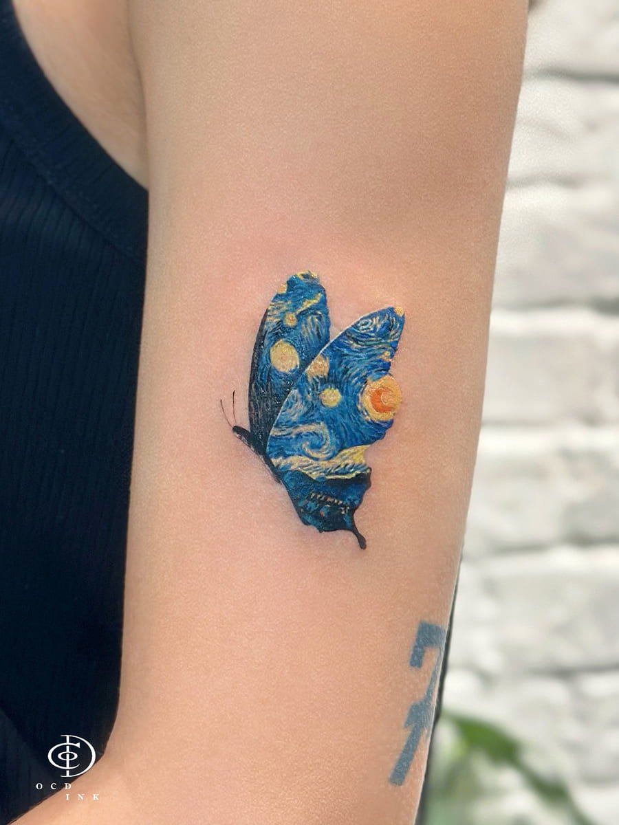 Fine art butterfly tattoo featuring wings inspired by Vincent van Gogh's The Starry Night, with vibrant blue, yellow, and black details on the upper arm.