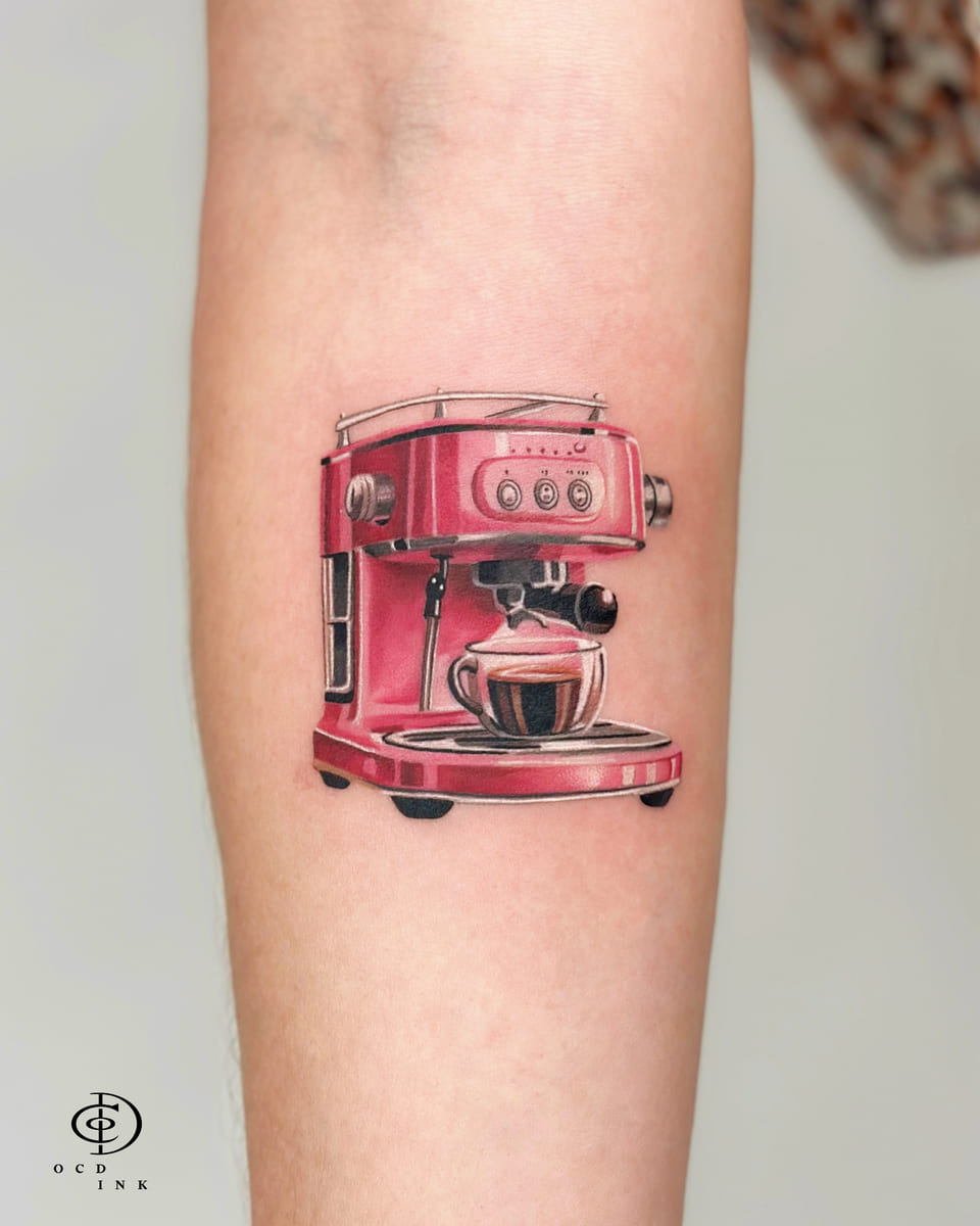 Micro realism tattoo of a vintage red espresso machine brewing a small cup of coffee, featuring realistic reflections, metallic details, and rich red tones on the forearm.