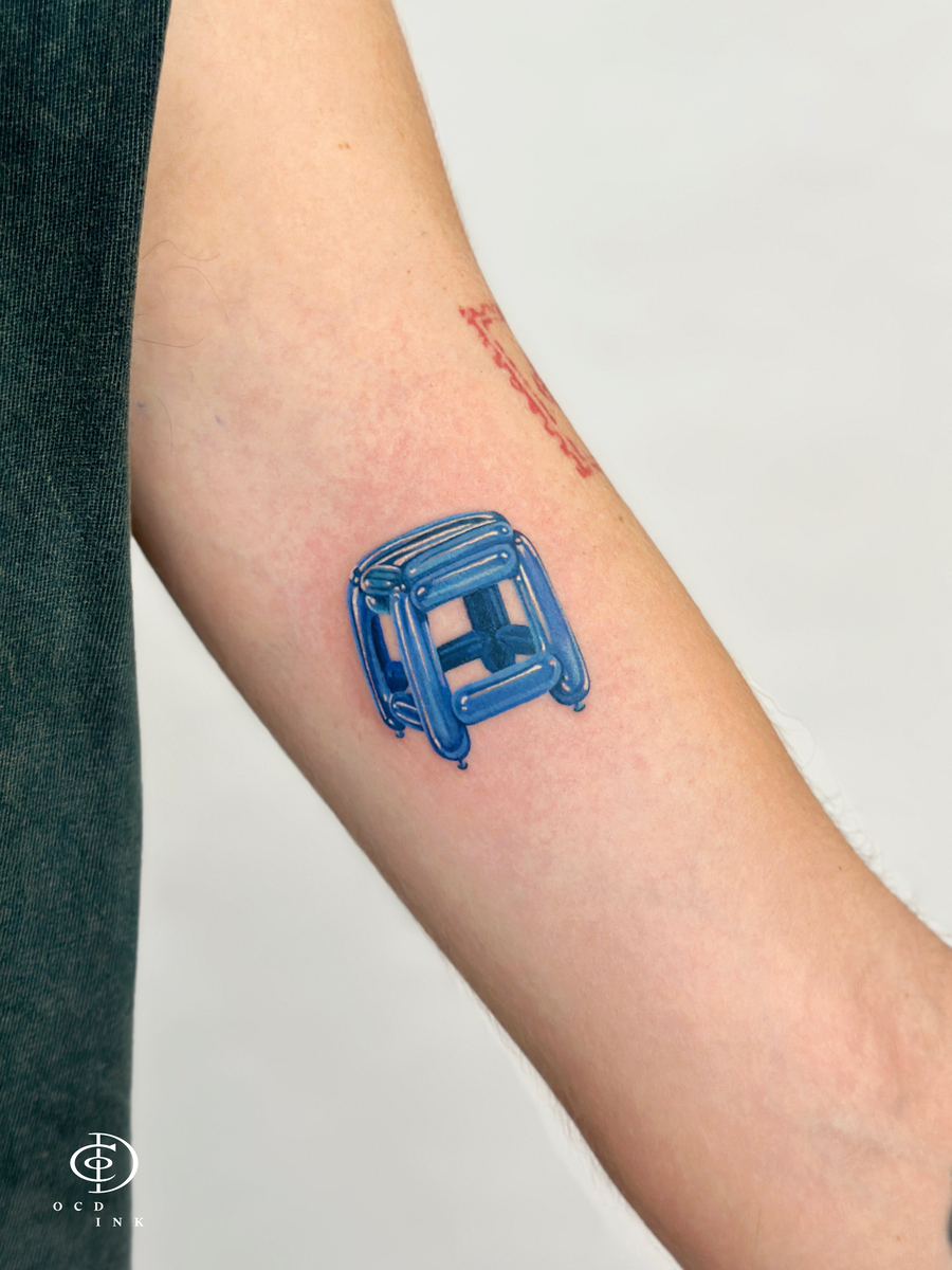 color micro realistic tattoo of bubble stool - OCD Ink Studio