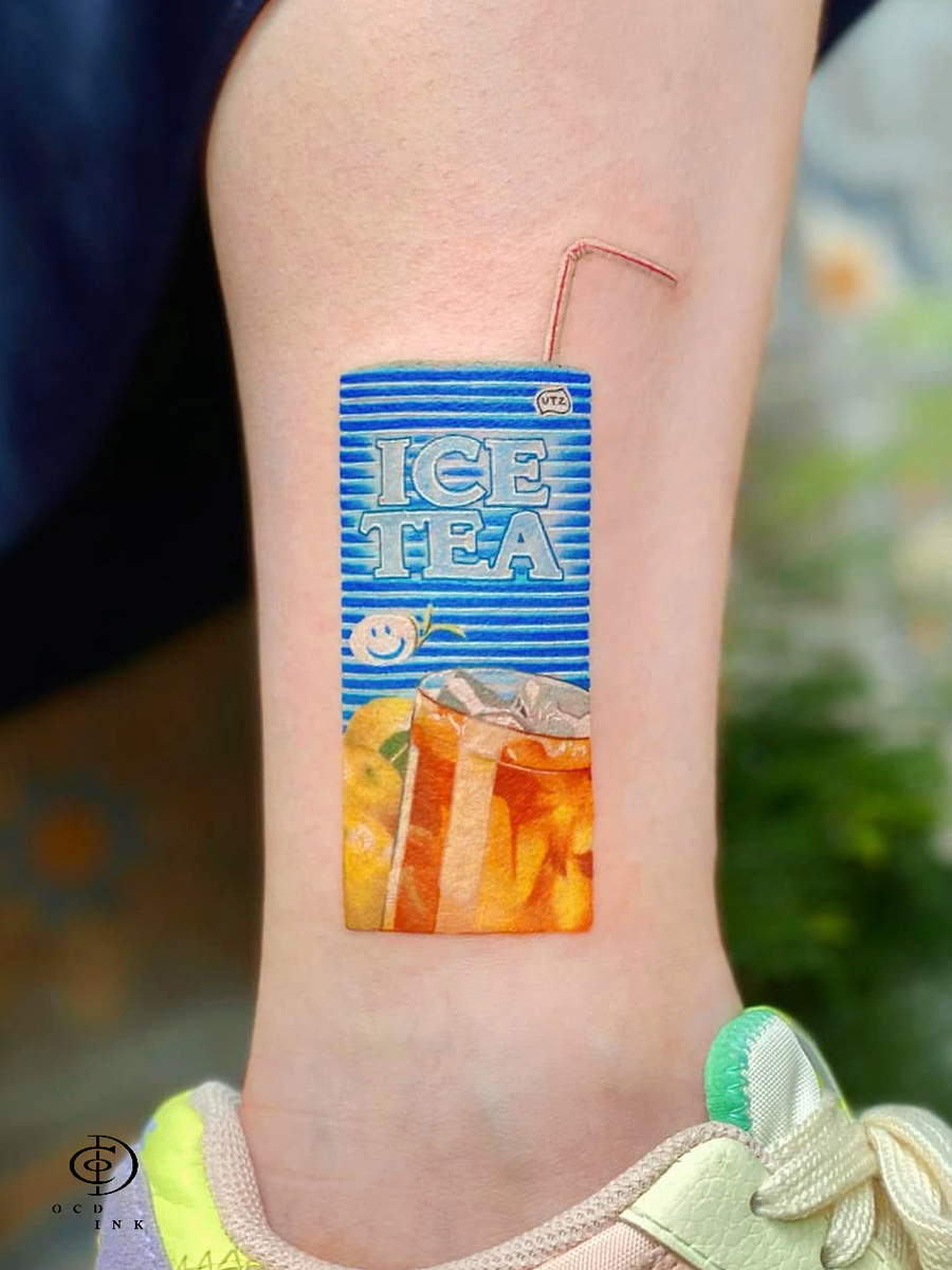 color micro realistic tattoo of ice tea box - OCD Ink Studio