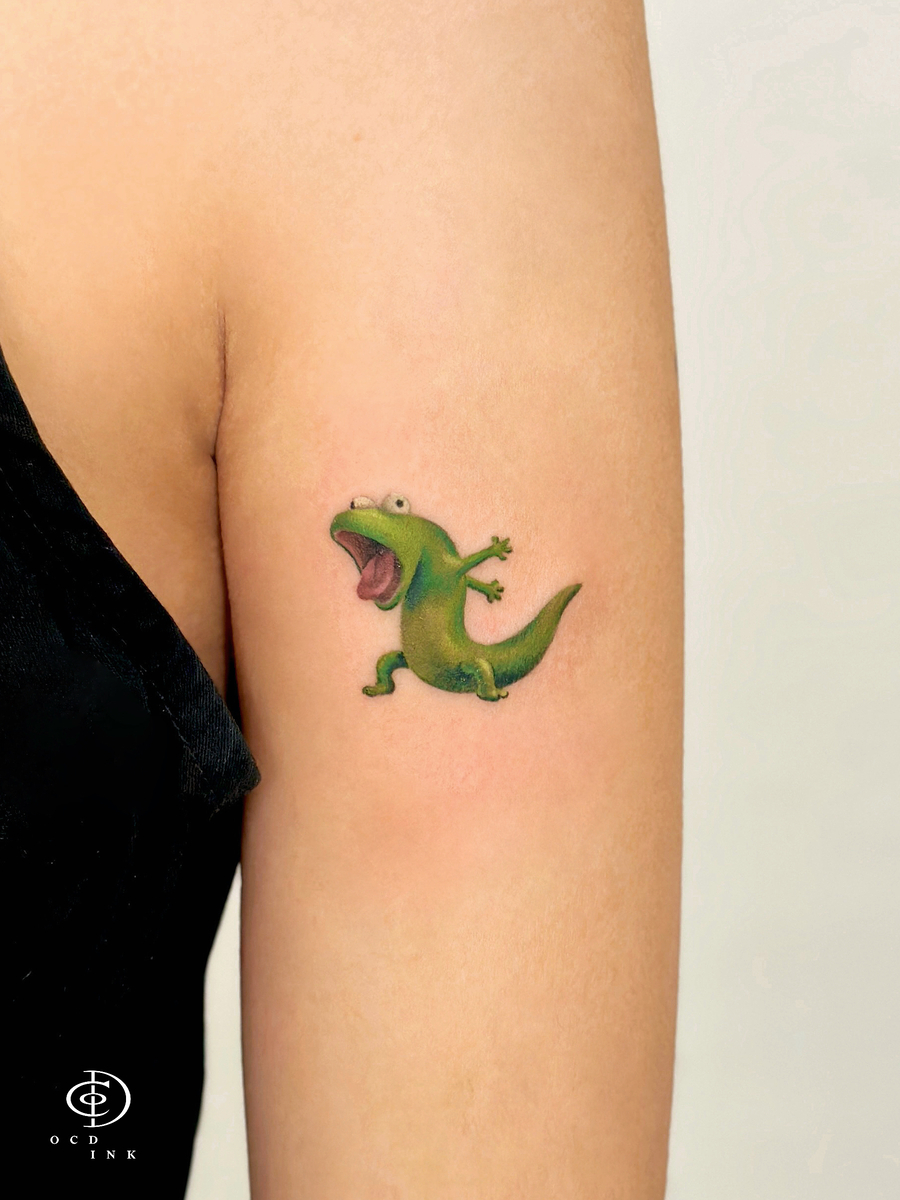 color realistic tattoo of the green lizard Tom - OCD Ink Studio