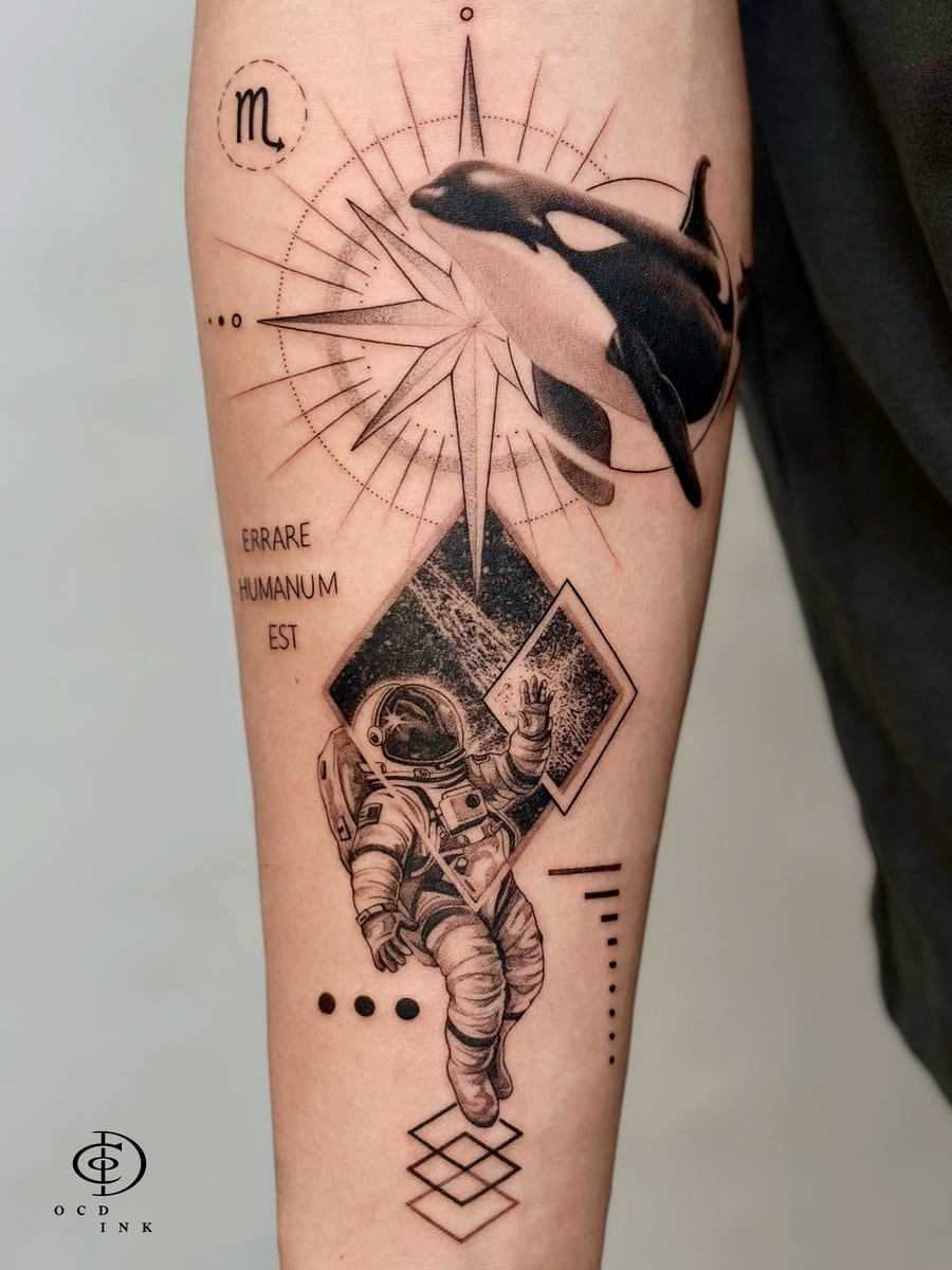 Graphic tattoo featuring an orca above a geometric starburst and an astronaut floating among abstract shapes and fine-line details