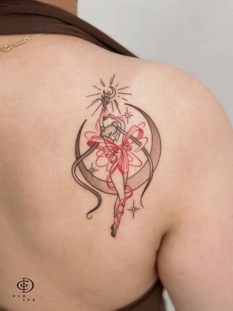 ILLUSTRATION Illustration tattoo of a magical girl framed by a crescent moon with flowing red ribbon details.