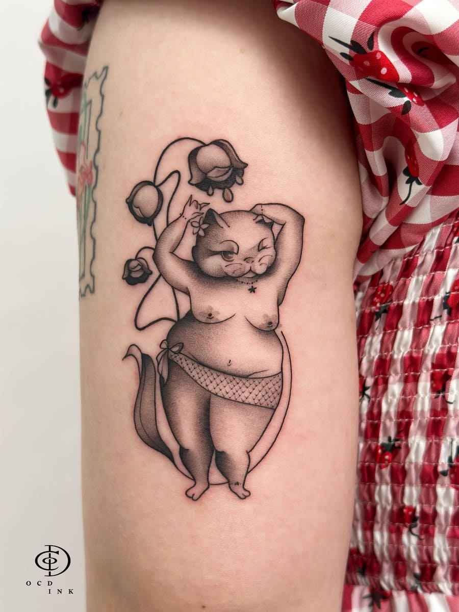 ILLUSTRATION Illustration tattoo of a whimsical anthropomorphic cat posing among drooping flowers in black and grey.
